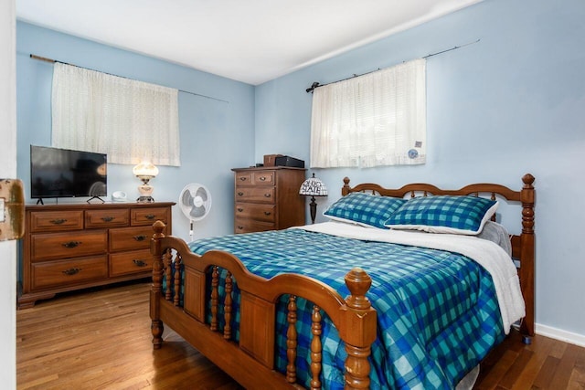 bedroom featuring wood finished floors