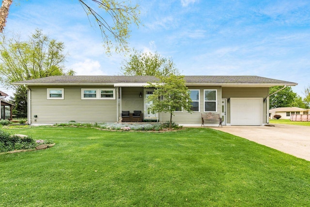 single story home with a garage, driveway, and a front yard