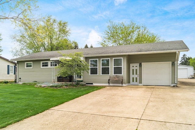 ranch-style house featuring a garage, concrete driveway, and a front yard