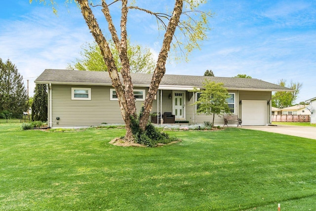 ranch-style house with driveway, a front lawn, and a garage