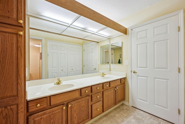 bathroom with double vanity and a sink
