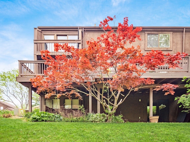 back of house with a yard