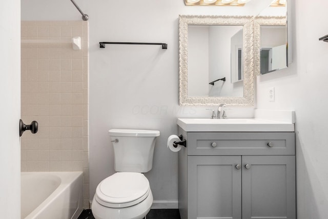 full bath featuring vanity, tub / shower combination, and toilet