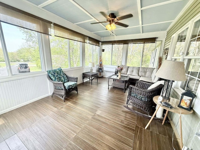 sunroom / solarium with a ceiling fan, outdoor lounge area, and a wealth of natural light