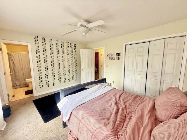 bedroom featuring a closet, carpet flooring, connected bathroom, and ceiling fan