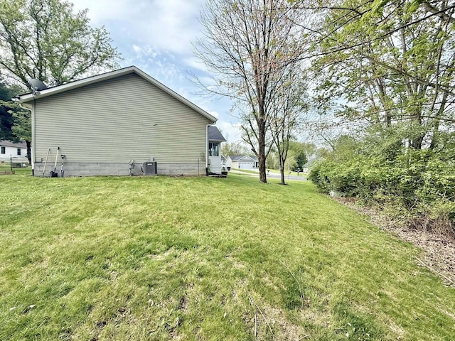 view of yard with central AC