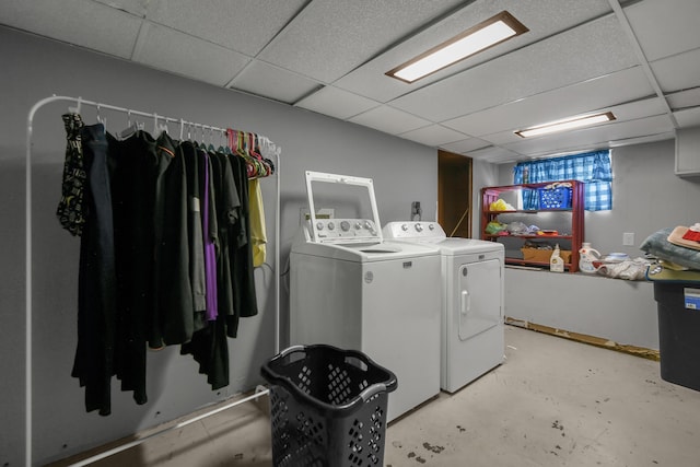 clothes washing area with laundry area and washer and clothes dryer