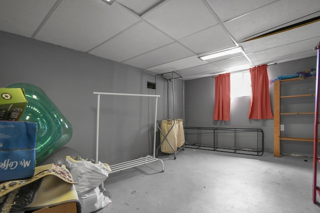 finished basement featuring a drop ceiling