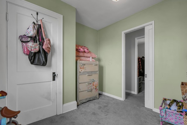 bedroom featuring baseboards and carpet flooring