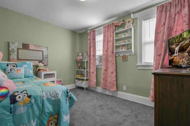 bedroom with carpet flooring and baseboards