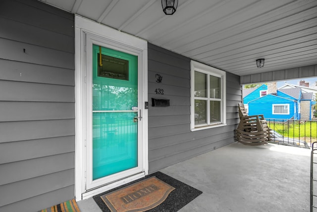 doorway to property with covered porch