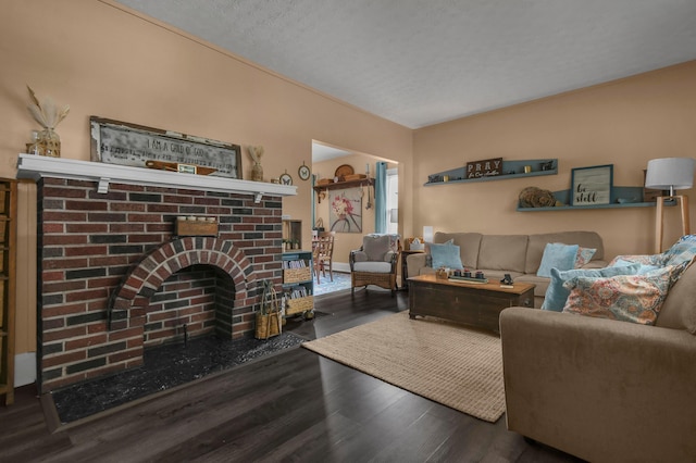 living room with wood finished floors and a fireplace