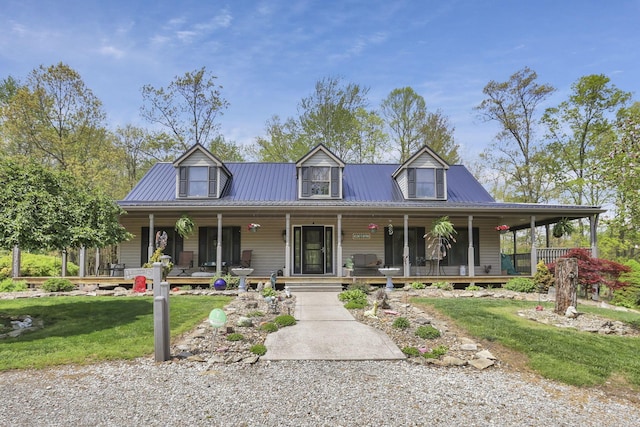 3615 Dragoo Rd, Nashport, OH 43830 - country-style home featuring covered porch, a front yard, and metal roof