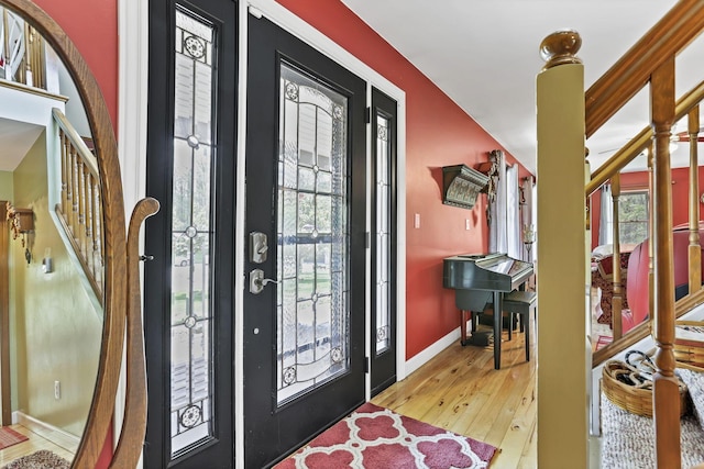 3615 Dragoo Rd, Nashport, OH 43830 - foyer entrance with wood-type flooring, baseboards, and stairway