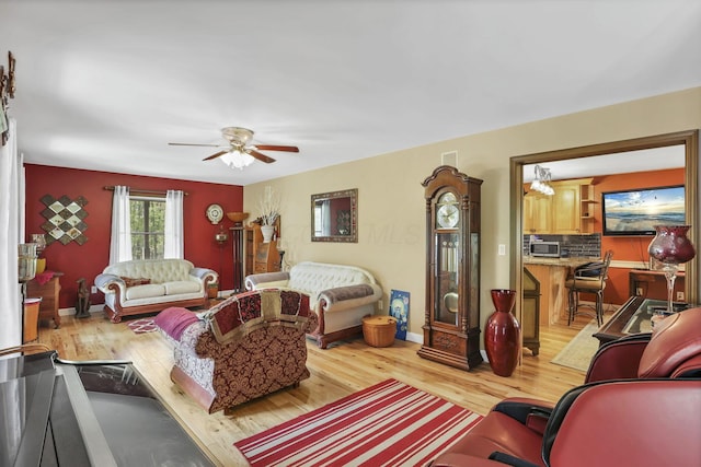 3615 Dragoo Rd, Nashport, OH 43830 - living room with a ceiling fan, baseboards, and light wood-type flooring