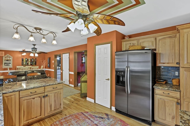 3615 Dragoo Rd, Nashport, OH 43830 - kitchen with light brown cabinets, stainless steel refrigerator with ice dispenser, tasteful backsplash, a ceiling fan, and light wood finished floors