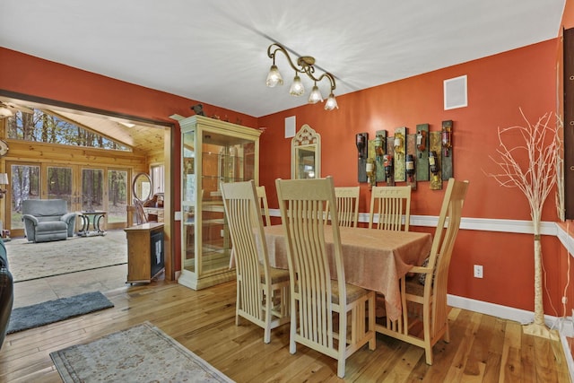 3615 Dragoo Rd, Nashport, OH 43830 - dining space featuring baseboards, wood-type flooring, and lofted ceiling