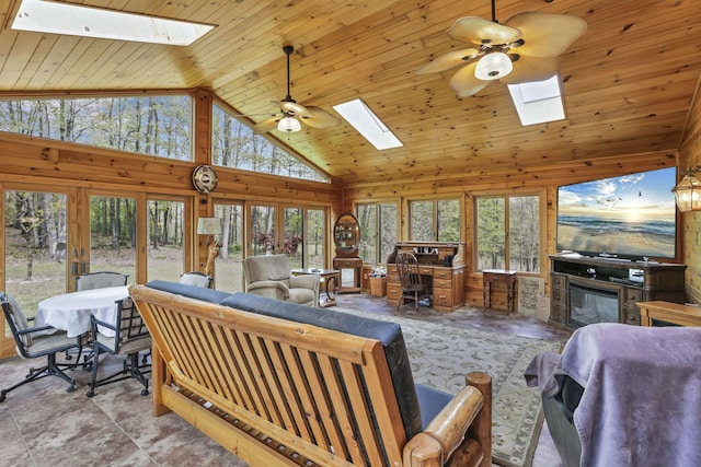 3615 Dragoo Rd, Nashport, OH 43830 - living room featuring a skylight, ceiling fan, and wooden walls