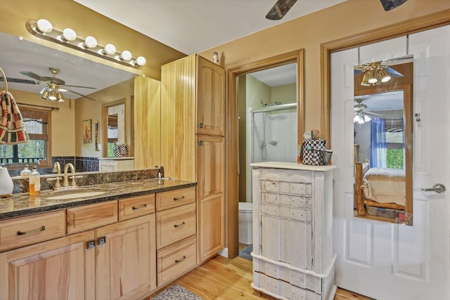 3615 Dragoo Rd, Nashport, OH 43830 - full bath with ceiling fan, vanity, toilet, wood finished floors, and a stall shower