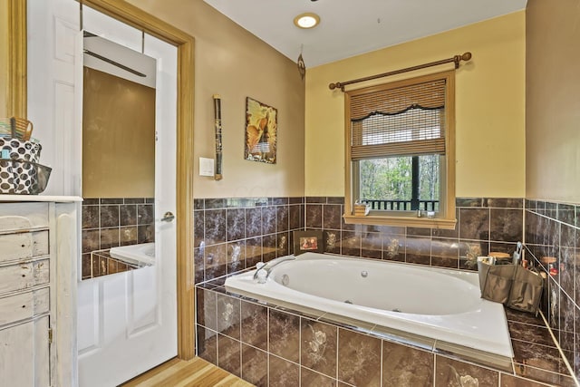 3615 Dragoo Rd, Nashport, OH 43830 - bathroom featuring a jetted tub and wood finished floors