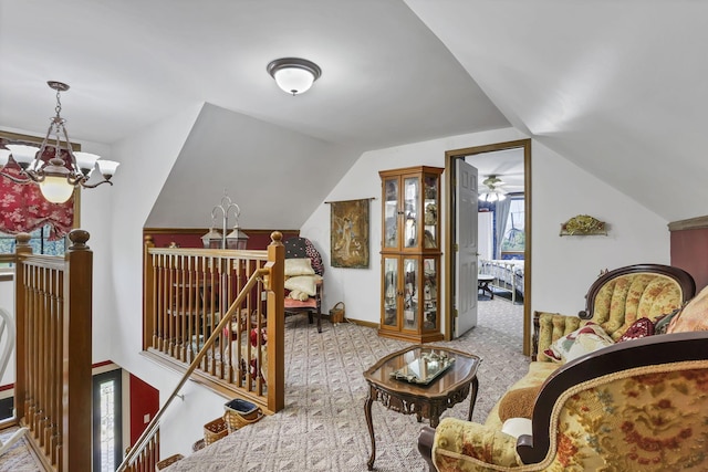 3615 Dragoo Rd, Nashport, OH 43830 - living area with carpet flooring, lofted ceiling, a chandelier, and an upstairs landing