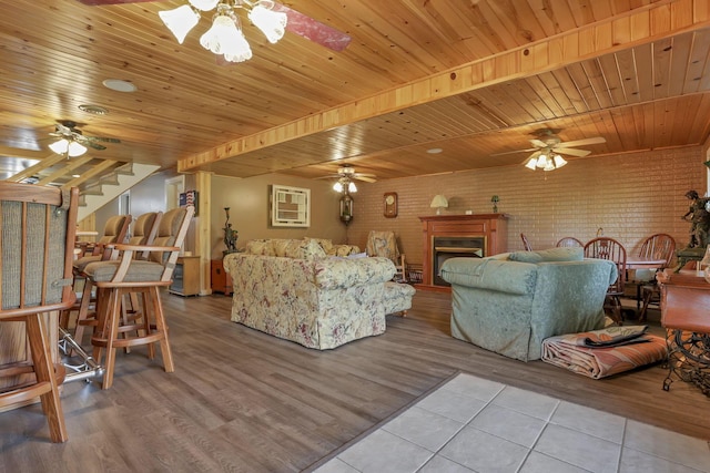 3615 Dragoo Rd, Nashport, OH 43830 - living area with stairs, ceiling fan, wooden ceiling, and tile patterned flooring