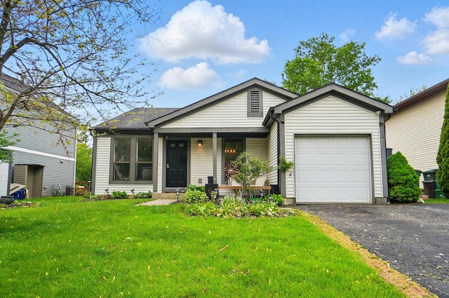 4969 Shannonbrook Dr, Columbus, OH 43221 - ranch-style home with an attached garage, a front lawn, aphalt driveway, and covered porch