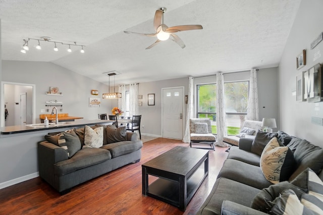 4969 Shannonbrook Dr, Columbus, OH 43221 - living area with ceiling fan, a textured ceiling, vaulted ceiling, wood finished floors, and baseboards