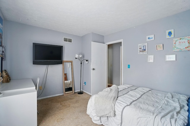 4969 Shannonbrook Dr, Columbus, OH 43221 - bedroom with a textured ceiling, baseboards, visible vents, and light carpet