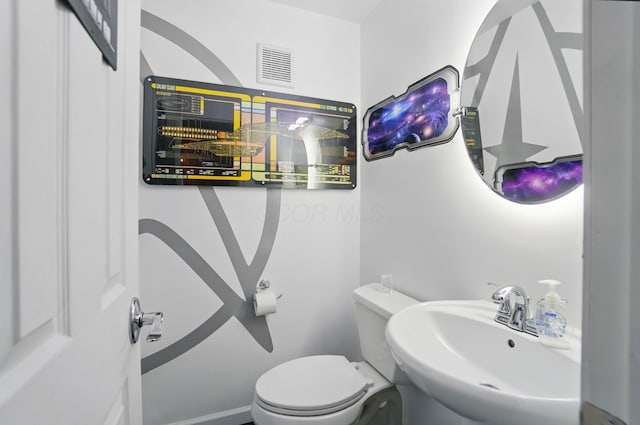 4969 Shannonbrook Dr, Columbus, OH 43221 - half bathroom featuring toilet, visible vents, and a sink