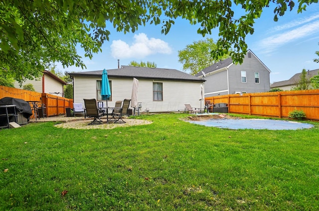 4969 Shannonbrook Dr, Columbus, OH 43221 - rear view of property with a fenced backyard, central AC unit, a yard, and a patio area