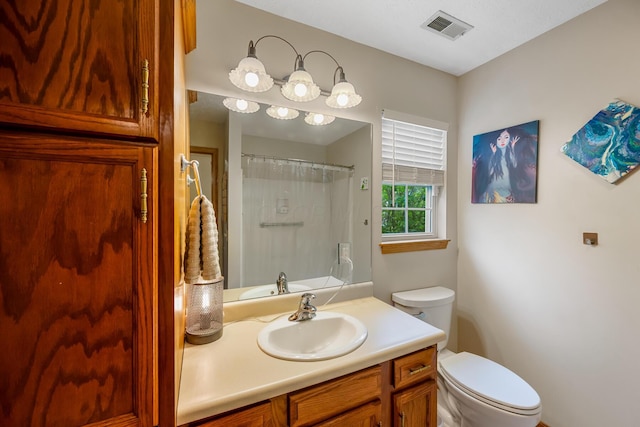 bathroom featuring vanity, a shower with curtain, toilet, and visible vents