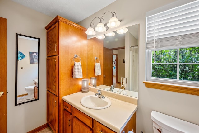 full bathroom with vanity and toilet