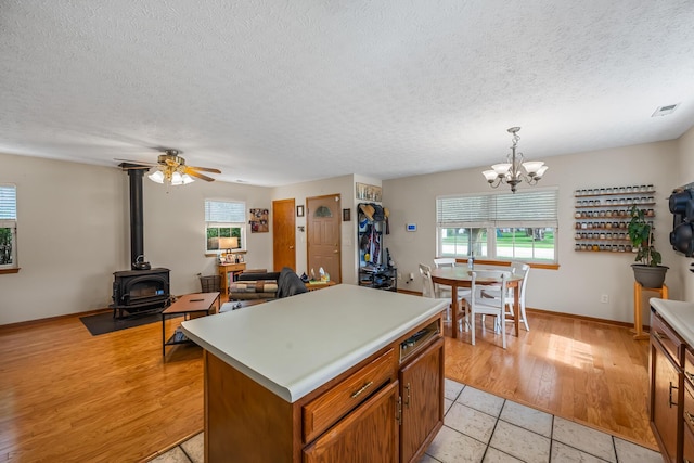 kitchen featuring light countertops, a textured ceiling, and a wealth of natural light