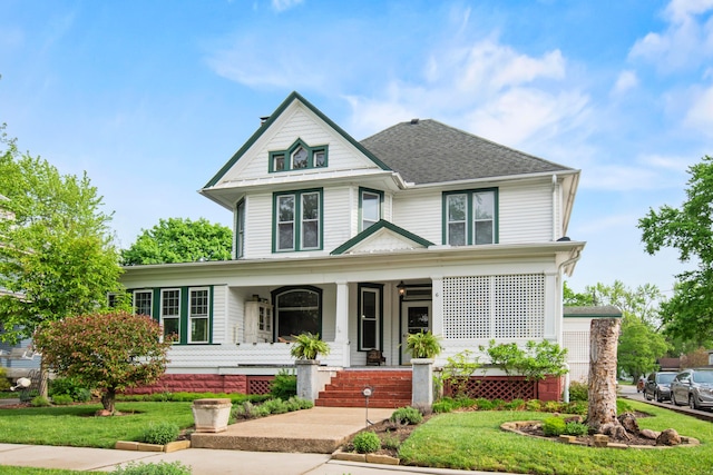 6 Town St, Pataskala, OH 43062 - victorian house featuring a porch, a front lawn, and roof with shingles