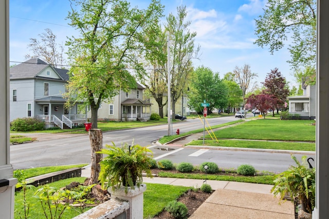 6 Town St, Pataskala, OH 43062 - view of asphalt street featuring sidewalks, traffic signs, curbs, and a residential view