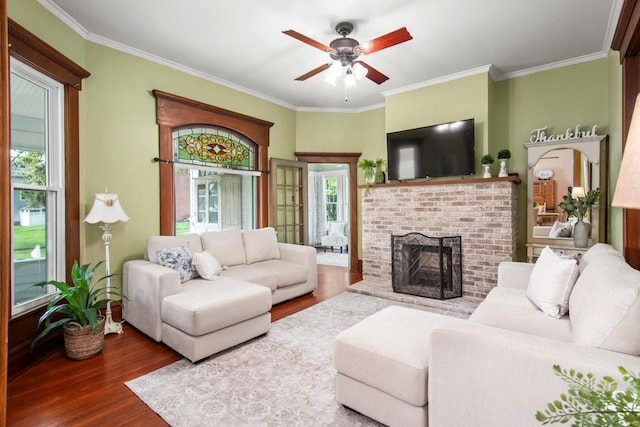 6 Town St, Pataskala, OH 43062 - living area with wood finished floors, a ceiling fan, ornamental molding, and a brick fireplace