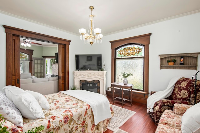 6 Town St, Pataskala, OH 43062 - bedroom featuring crown molding, a chandelier, wood finished floors, and a high end fireplace
