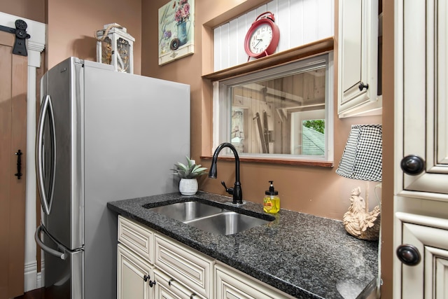 6 Town St, Pataskala, OH 43062 - kitchen featuring a sink, cream cabinets, and freestanding refrigerator