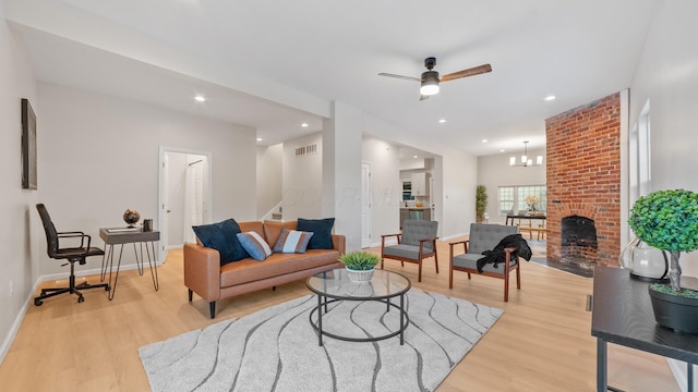 502 Hamilton Ave, Columbus, OH 43203 - living room featuring stairs, a ceiling fan, light wood-style floors, baseboards, and recessed lighting
