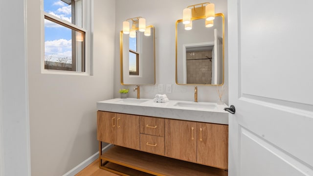 502 Hamilton Ave, Columbus, OH 43203 - full bathroom featuring double vanity and baseboards