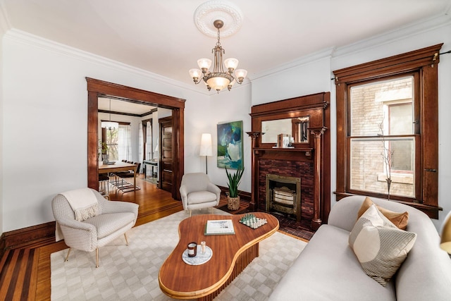 living room featuring crown molding and a chandelier
