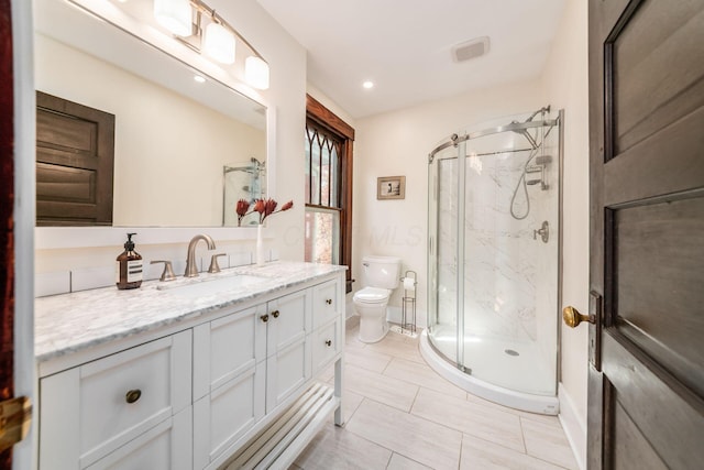 full bathroom with vanity, recessed lighting, a marble finish shower, and toilet
