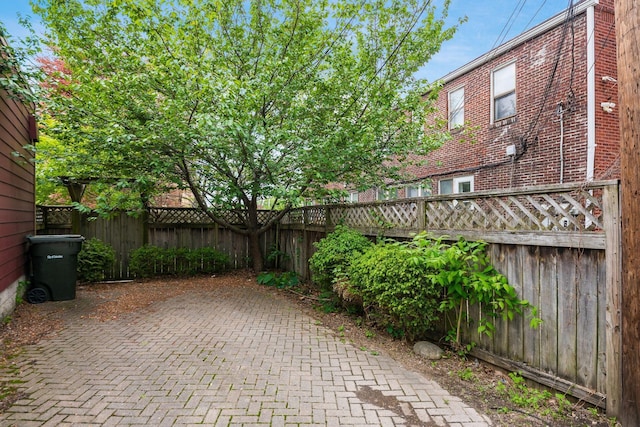 view of patio featuring fence