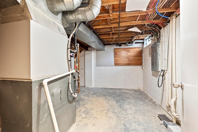 unfinished basement with heating unit and electric panel