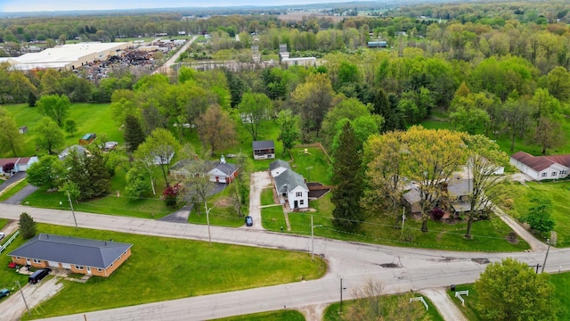 birds eye view of property featuring a wooded view