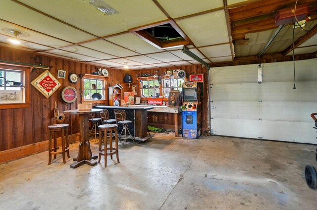 garage featuring wooden walls