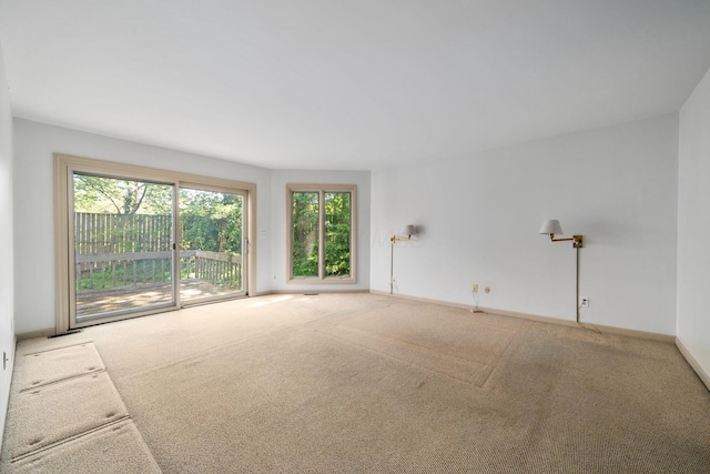 1624 Coppertree Ln, Columbus, OH 43232 - unfurnished living room with plenty of natural light, carpet, and baseboards