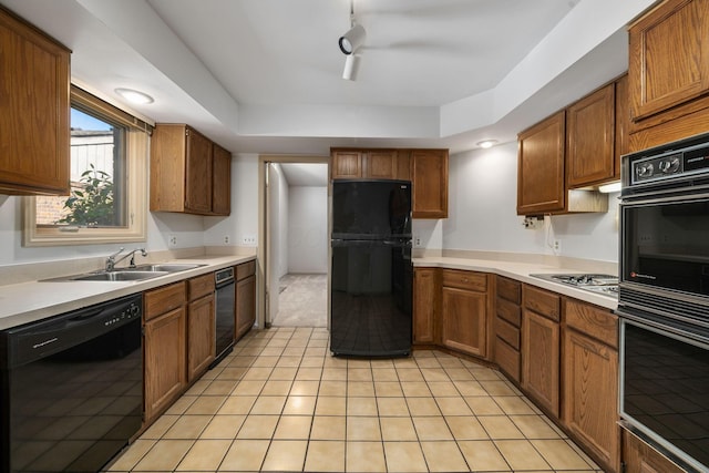 1624 Coppertree Ln, Columbus, OH 43232 - kitchen with black appliances, a sink, and brown cabinets