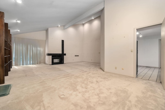 1624 Coppertree Ln, Columbus, OH 43232 - unfurnished living room featuring carpet flooring, lofted ceiling, a fireplace, and recessed lighting